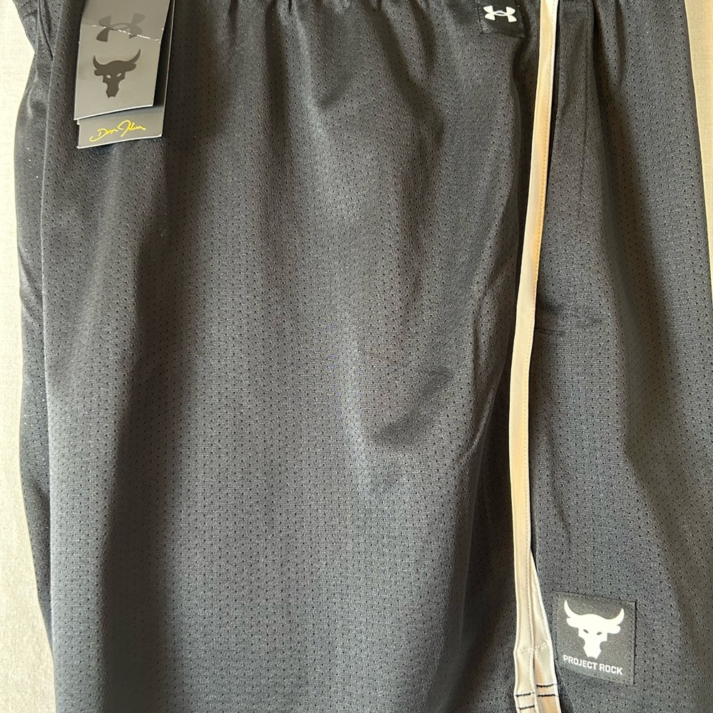 Project Rock Athletic Shorts in Black. A1658